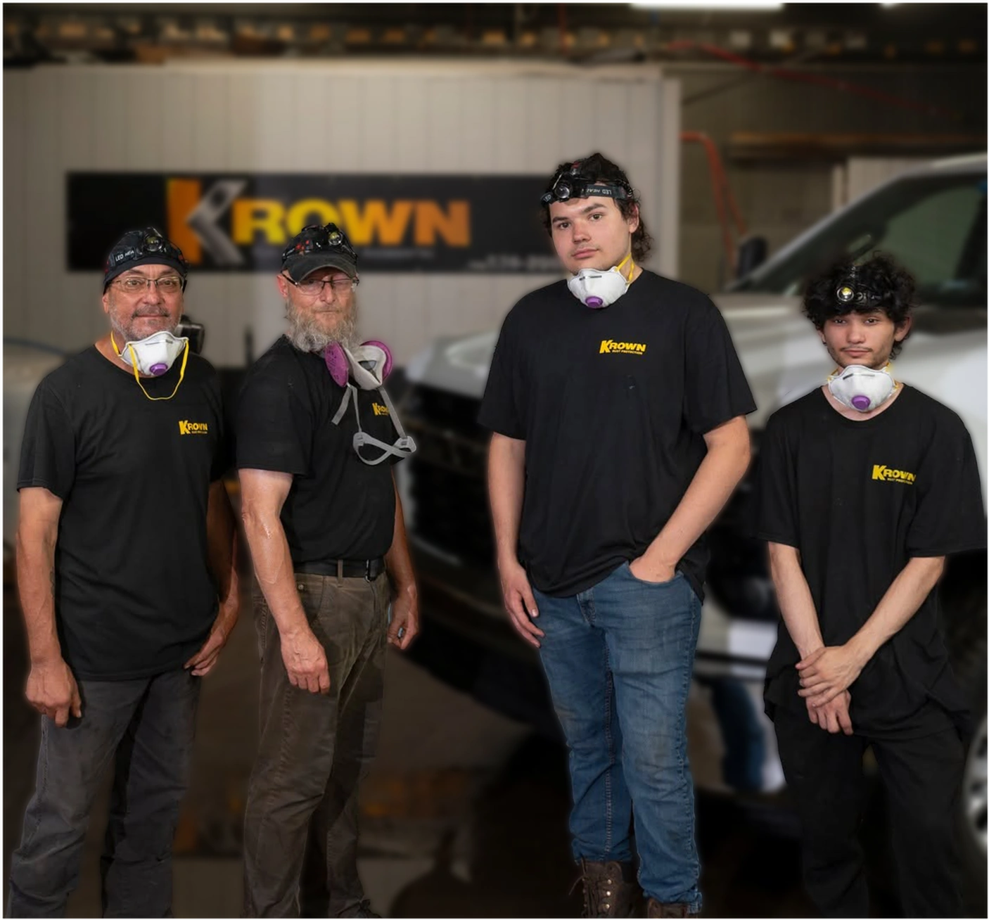 Four members of the Krown crew wearing respirators in the shop