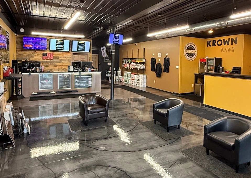 The Krown Stanley waiting room, with leather chairs and the Krown Cafe counter